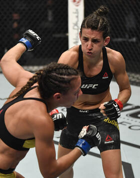 Marina Rodriguez of Brazil punches Amanda Ribas of Brazil in a strawweight fight during the UFC 257 event