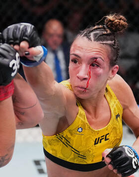 Amanda Ribas of Brazil punches Luana Pinheiro of Brazil in a strawweight fight during the UFC Fight Night event at UFC APEX on November 18, 2023 in Las Vegas, Nevada. (Photo by Chris Unger/Zuffa LLC)