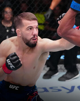 Cody Durden punches Carlos Mota of Brazil in a flyweight fight during the UFC Fight Night event at UFC APEX on October 29, 2022 in Las Vegas, Nevada. (Photo by Jeff Bottari/Zuffa LLC)