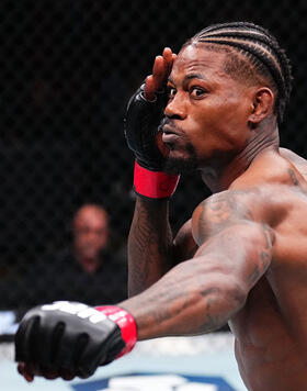 Kevin Holland punches Michael 'Venom' Page of England in a welterweight fight during the UFC 299 event at Kaseya Center on March 09, 2024 in Miami, Florida. (Photo by Chris Unger/Zuffa LLC)