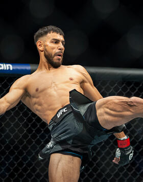 UFC featherweight Yair Rodriguez kicks Josh Emmett in their UFC 284 bout. (Photo by Nolan Walker/ Zuffa LLC)