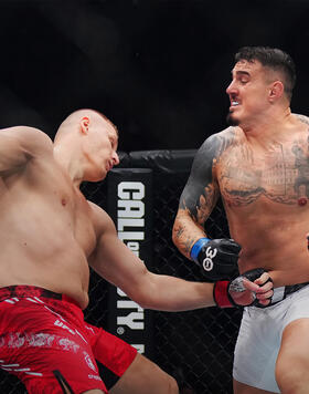 Tom Aspinall of England knocks down Sergei Pavlovich of Russia in the interim UFC heavyweight championship fight during the UFC 295 event at Madison Square Garden on November 11, 2023 in New York City. (Photo by Cooper Neill/Zuffa LLC)