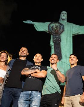 (L-R) Charles Oliveira, Amanda Ribas, Antônio Rodrigo Nogueira, Jose Aldo, Rafael dos Anjos, Vicente Luque and Renato Moicano pose for a portrait under Cristo Redentor in Rio de Janeiro, Brazil, January 2023 (Photo by Juan Cardenas/Zuffa LLC)