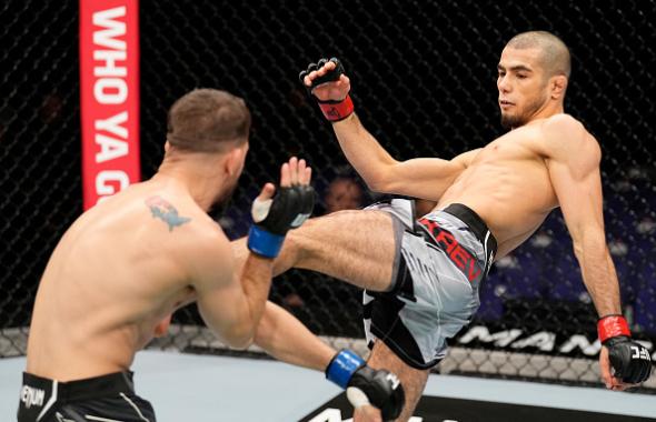 Muhammad Mokaev of England kicks Cody Durden in a flyweight fight during the UFC Fight Night event at O2 Arena on March 19, 2022 in London, England. (Photo by Chris Unger/Zuffa LLC)