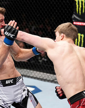 Arnold Allen of England punches Dan Hooker of New Zealand in a featherweight fight during the UFC Fight Night event at O2 Arena on March 19, 2022 in London, England. (Photo by Chris Unger/Zuffa LLC)