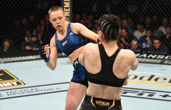 Rose Namajunas kicks Zhang Weili of China in their UFC women's strawweight championship bout during the UFC 261 event at VyStar Veterans Memorial Arena on April 24, 2021 in Jacksonville, Florida. (Photo by Josh Hedges/Zuffa LLC)