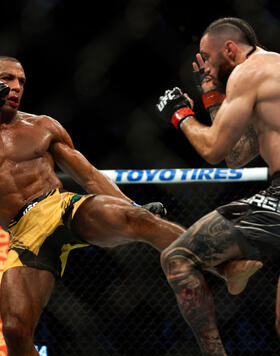 Edson Barboza of Brazil kicks Shane Burgos in their featherweight bout during the UFC 262 event at Toyota Center on May 15, 2021 in Houston, Texas. (Photo by Cooper Neill/Zuffa LLC)