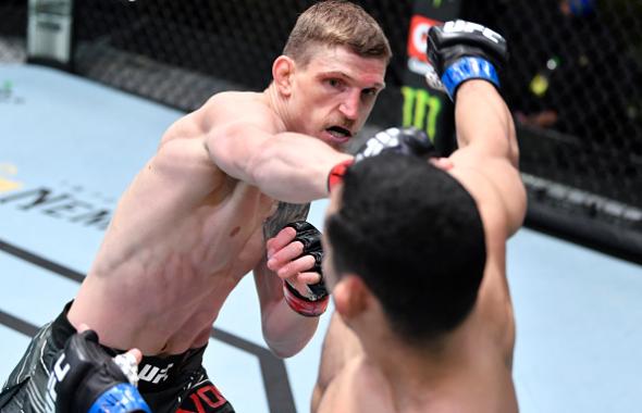 David Dvorak of Czech Republic punches Juancamilo Ronderos of Columbia in their flyweight bout during the UFC Fight Night event at UFC APEX on May 22, 2021 in Las Vegas, Nevada. (Photo by Chris Unger/Zuffa LLC)