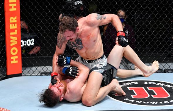 Jack Hermansson of Norway controls the body of Edmen Shahbazyan as he punches him in their middleweight bout during the UFC Fight Night event at UFC APEX on May 22, 2021 in Las Vegas, Nevada. (Photo by Chris Unger/Zuffa LLC)