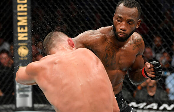 Leon Edwards of Jamaica punches Nate Diaz in their welterweight fight during the UFC 263 event at Gila River Arena on June 12, 2021 in Glendale, Arizona. (Photo by Jeff Bottari/Zuffa LLC)