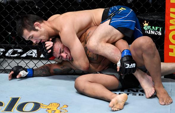 Shavkat Rakhmonov of Uzbekistan secures a rear choke submission against Michel Prazeres of Brazil in a welterweight fight during the UFC Fight Night event at UFC APEX on June 26, 2021 in Las Vegas, Nevada. (Photo by Chris Unger/Zuffa LLC)