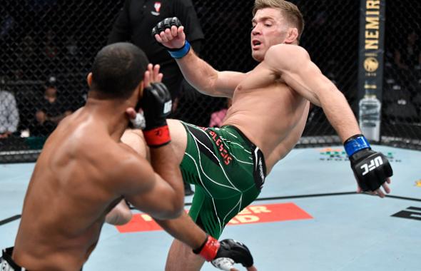  Dricus Du Plessis of South Africa kicks Trevin Giles in their middleweight fight during the UFC 264 event at T-Mobile Arena on July 10, 2021 in Las Vegas, Nevada. (Photo by Jeff Bottari/Zuffa LLC)