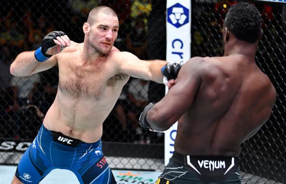 Sean Strickland punches Uriah Hall of Jamaica in a middleweight fight during the UFC Fight Night event at UFC APEX on July 31, 2021 in Las Vegas, Nevada. (Photo by Chris Unger/Zuffa LLC)