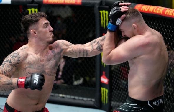 Tom Aspinall of England punches Serghei Spivak of the Ukraine in their welterweight fight during the UFC Fight Night event at UFC APEX on September 04, 2021 in Las Vegas, Nevada. (Photo by Jeff Bottari/Zuffa LLC)