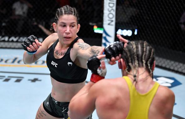 Karol Rosa of Brazil punches Bethe Correia of Brazil in their women's bantamweight bout during the UFC Fight Night event at UFC APEX on October 02, 2021 in Las Vegas, Nevada. (Photo by Jeff Bottari/Zuffa LLC)