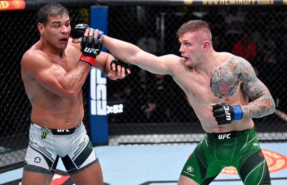 Marvin Vettori of Italy punches Paulo Costa of Brazil in a light heavyweight fight during the UFC Fight Night event at UFC APEX on October 23, 2021 in Las Vegas, Nevada. (Photo by Jeff Bottari/Zuffa LLC)