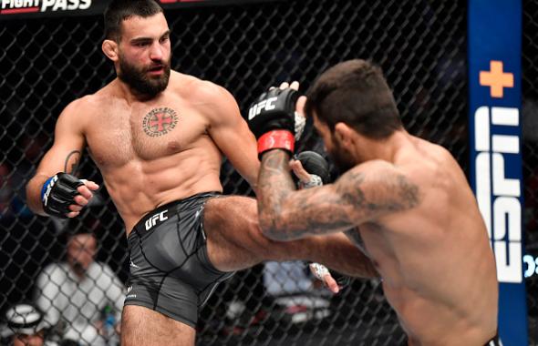 Benoit Saint Denis of France kicks Elizeu Zaleski dos Santos of Brazil in a welterweight fight during the UFC 267 event at Etihad Arena on October 30, 2021 in Yas Island, Abu Dhabi, United Arab Emirates. (Photo by Chris Unger/Zuffa LLC)