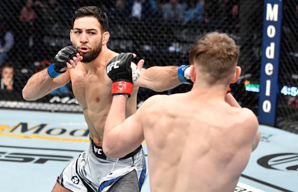 Nassourdine Imavov of Russia punches Edmen Shahbazyan in their middleweight fight during the UFC 268 event at Madison Square Garden on November 06, 2021 in New York City. (Photo by Jeff Bottari/Zuffa LLC)