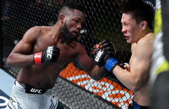 Manel Kape of Angola punches Zhalgas Zhumagulov of Kazakhstan in their flyweight fight during the UFC Fight Night event at UFC APEX on December 04, 2021 in Las Vegas, Nevada. (Photo by Jeff Bottari/Zuffa LLC)