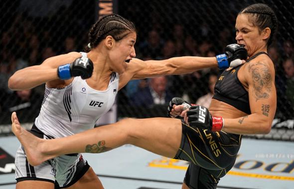 Julianna Pena punches Amanda Nunes of Brazil in their UFC bantamweight championship bout during the UFC 269 on December 11, 2021 in Las Vegas, Nevada. (Photo by Jeff Bottari/Zuffa LLC)