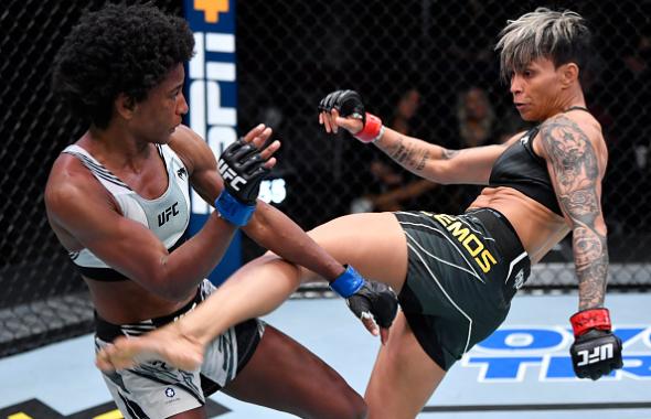 Amanda Lemos of Brazil kicks Angela Hill in their bantamweight fight during the UFC Fight Night event at UFC APEX on December 18, 2021 in Las Vegas, Nevada. (Photo by Jeff Bottari/Zuffa LLC)