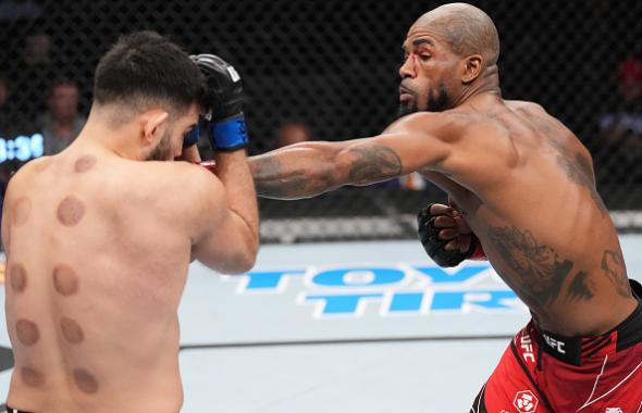  Bobby Green punches Nasrat Haqparast of Germany in their lightweight fight during the UFC 271 event at Toyota Center on February 12, 2022 in Houston, Texas. (Photo by Josh Hedges/Zuffa LLC)