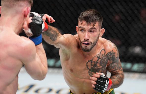 Matheus Nicolau of Brazil punches David Dvorak of Czech Republic in a flyweight fight during the UFC Fight Night event at Nationwide Arena on March 26, 2022 in Columbus, Ohio. (Photo by Josh Hedges/Zuffa LLC)