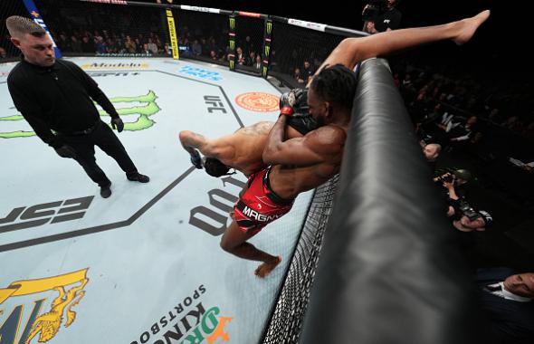 Neil Magny lifts Max Griffin in a welterweight fight during the UFC Fight Night event at Nationwide Arena on March 26, 2022 in Columbus, Ohio. (Photo by Josh Hedges/Zuffa LLC