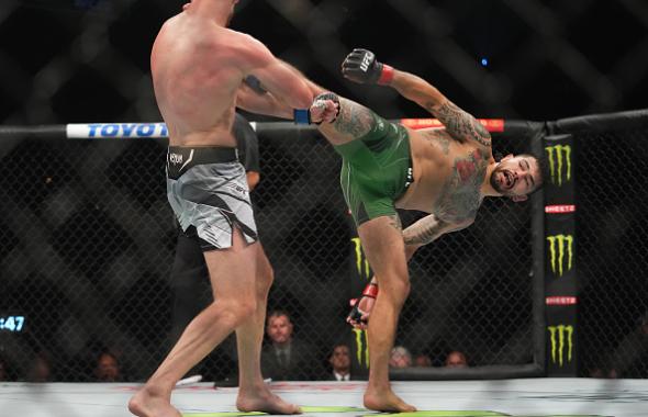 Anthony Hernandez kicks Josh Fremd in their middleweight fight during the UFC 273 event at VyStar Veterans Memorial Arena on April 09, 2022 in Jacksonville, Florida. (Photo by Cooper Neill/Zuffa LLC)