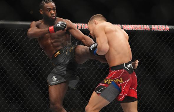 Aljamain Sterling kicks Petr Yan of Russia in their UFC bantamweight championship fight during the UFC 273 event at VyStar Veterans Memorial Arena on April 09, 2022 in Jacksonville, Florida. (Photo by Cooper Neill/Zuffa LLC)