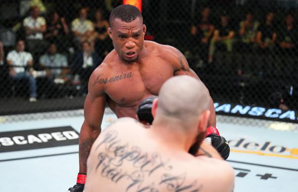 Jailton Almeida of Brazil kicks Parker Porter in a heavyweight bout during the UFC Fight Night event at UFC APEX on May 21, 2022 in Las Vegas, Nevada. (Photo by Chris Unger/Zuffa LLC)