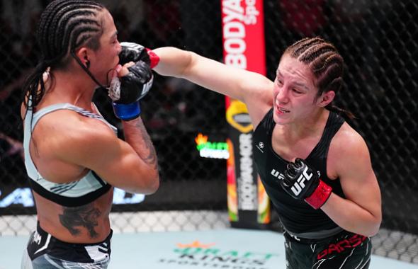 Alexa Grasso of Mexico punches Viviane Araujo of Brazil in a flyweight fight during the UFC Fight Night event at UFC APEX on October 15, 2022 in Las Vegas, Nevada. (Photo by Jeff Bottari/Zuffa LLC)