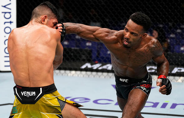 Lerone Murphy of England punches Gabriel Santos of Brazil in a featherweight fight during the UFC 286 event at The O2 Arena on March 18, 2023 in London, England. (Photo by Jeff Bottari/Zuffa LLC)