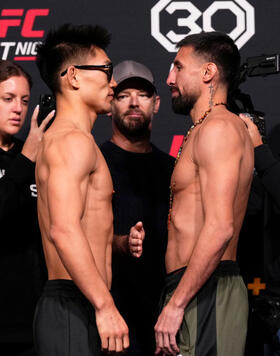 Song Yadong of China and Chris Gutierrez face off during the UFC Fight Night weigh-in at UFC APEX on December 08, 2023 in Las Vegas, Nevada. (Photo by Jeff Bottari/Zuffa LLC)