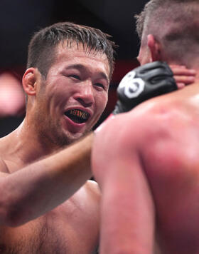 Shavkat Rakhmonov of Uzbekistan talks to Stephen Thompson at the end of their welterweight fight during the UFC 296 event at T-Mobile Arena on December 16, 2023 in Las Vegas, Nevada. (Photo by Cooper Neill/Zuffa LLC)