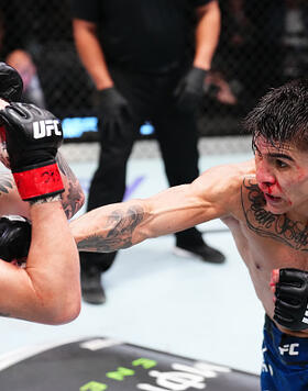 Mario Bautista punches Ricky Simon in a bantamweight fight during the UFC Fight Night event at UFC APEX on January 13, 2024 in Las Vegas, Nevada. (Photo by Chris Unger/Zuffa LLC)