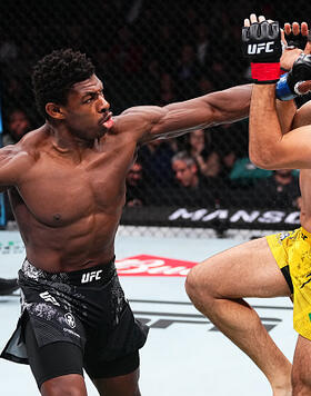 Joaquin Buckley punches Vicente Luque in a welterweight bout during the UFC Fight Night event at Boardwalk Hall Arena on March 30, 2024 in Atlantic City, New Jersey. (Photo by Jeff Bottari/Zuffa LLC)