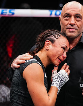 Michelle Waterson-Gomez embraces UFC commentator Joe Rogan following being defeated in a strawweight fight by Gillian Robertson of Canada during the UFC 303 event at T-Mobile Arena on June 29, 2024 in Las Vegas, Nevada. (Photo by Jeff Bottari/Zuffa LLC)