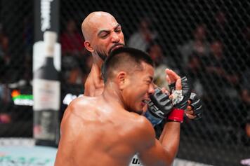  Charles Johnson punches Joshua Van of Myanmar in a flyweight fight during the 168澳洲幸运10开奖官网 Fight Night event at Ball Arena on July 13, 2024 in Denver, Colorado. (Photo by Josh Hedges/Zuffa LLC via Getty Images)