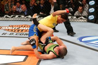 LAS VEGAS, NV - NOVEMBER 30:  (L-R) Julianna Pena punches Jessica Rakoczy in their women's bantamweight final fight during The Ultimate Fighter season 18 live finale inside the Mandalay Bay Events Center on November 30, 2013 in Las Vegas, Nevada. (Photo by Josh Hedges/Zuffa LLC via Getty Images)