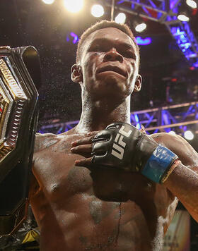  Israel Adesanya holds up the belt after defeating Kelvin Gastelum by unanimous decision in their interim middleweight championship bout during the UFC 236 event at State Farm Arena on April 13, 2019 in Atlanta, Georgia. (Photo by Carmen Mandato/Zuffa LLC)