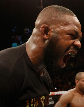  UFC light heavyweight champion Jon Jones (L) celebrates his win over Daniel Cormier (R) in their UFC light heavyweight championship bout during the UFC 182 event at the MGM Grand Garden Arena on January 3, 2015 in Las Vegas, Nevada. (Photo by Josh Hedges/Zuffa LLC/Zuffa LLC)